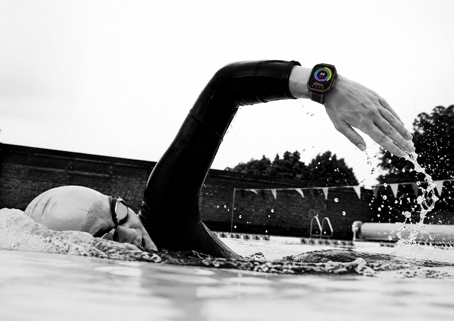An open-water swimmer at dawn, the start of the biggest day in sport
